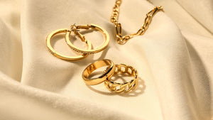 gold rings, earrings, and necklace
