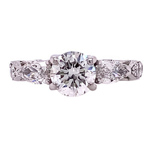 Three Stone Round Diamond and Pear Shaped Ring