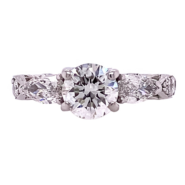Three Stone Round Diamond and Pear Shaped Ring