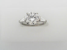 Round Brilliant Cut Diamond Ring with Tapered Baguettes