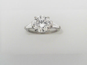 Round Brilliant Cut Diamond Ring with Tapered Baguettes