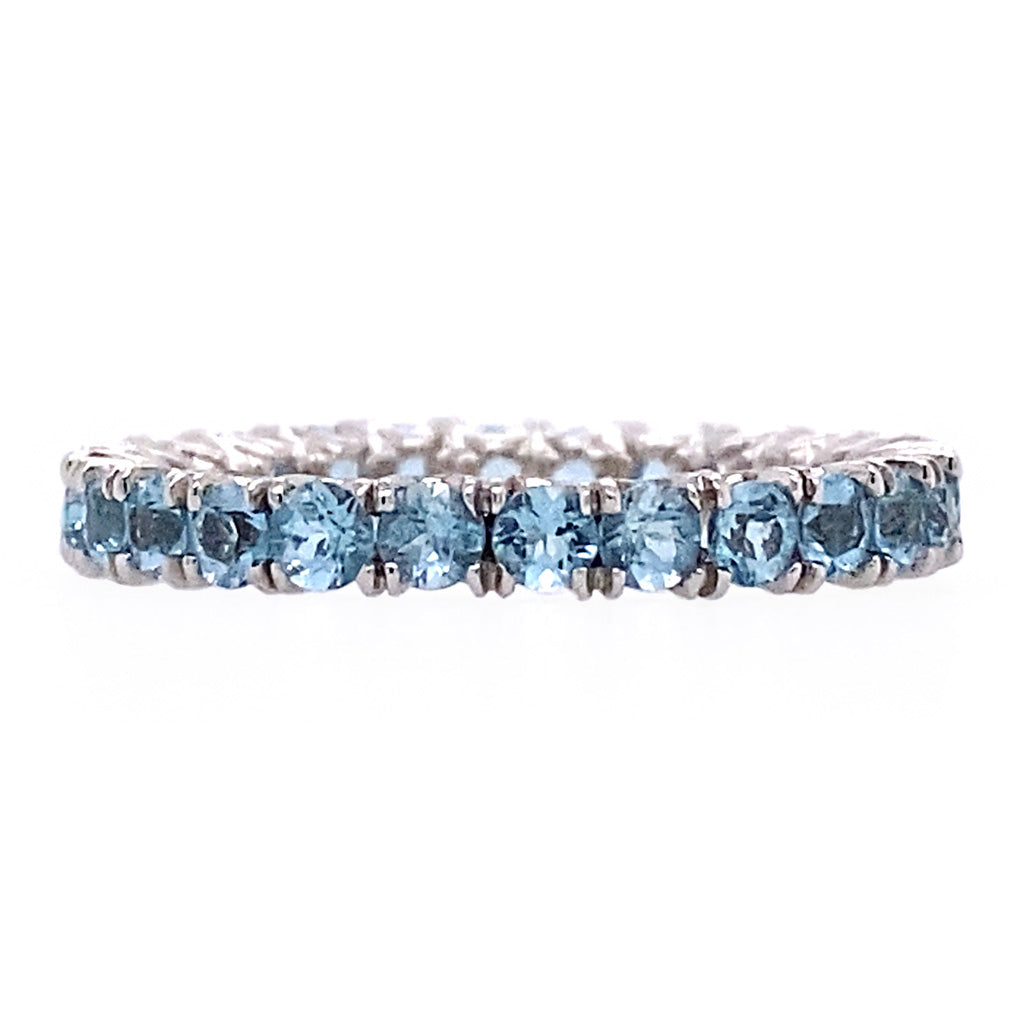 Blue topaz eternity band